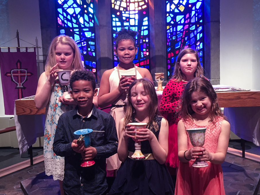 Children holding chalices